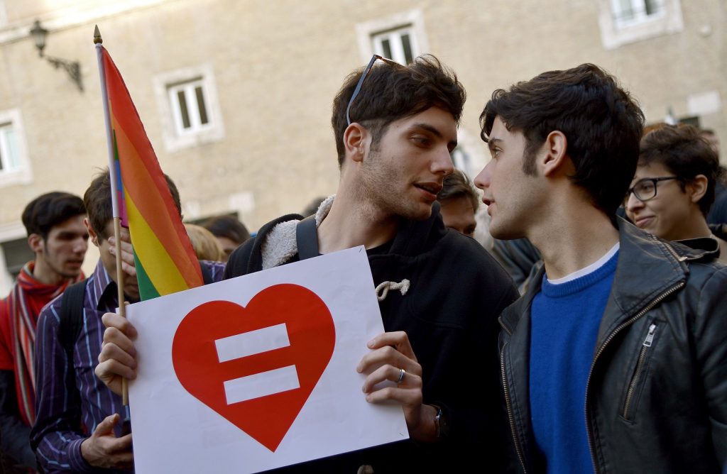 Supporters of same-sex civil unions demonstrate at the Piazza delle Cinque Lune in Rome on February 24, 2016. Prime Minister Matteo Renzi is bowing to Catholic pressure to remove stepchild adoption rights from the civil unions bill to ease its passage through parliament -- to the fury of gay rights groups. Renzi has called for a vote of confidence on the draft law, expected later this week and without the stepchild clause. / AFP / FILIPPO MONTEFORTE        (Photo credit should read FILIPPO MONTEFORTE/AFP/Getty Images)